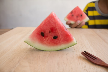 Wall Mural - Slices of watermelon on wooden desk background