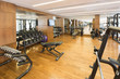 © arizanko - Modern gym interior with equipment.fitness center interior
