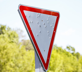 Road sign shot from a gun