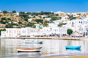 Wall Mural - Mykonos harbor and reflections of the whitewashed town in the aegean sea, Mykonos island, Cyclades, Greece