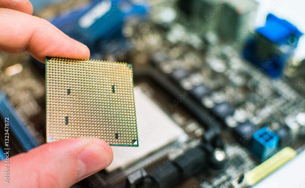 Installing the CPU into the motherboard Stock Photo | Adobe Stock