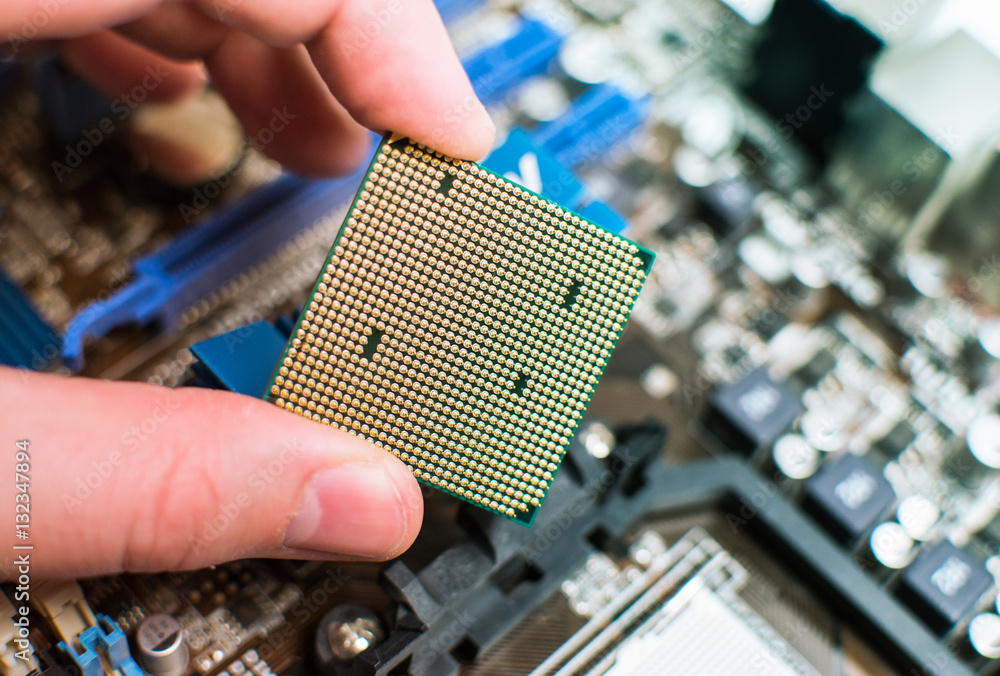 Installing the CPU into the motherboard Stock Photo | Adobe Stock