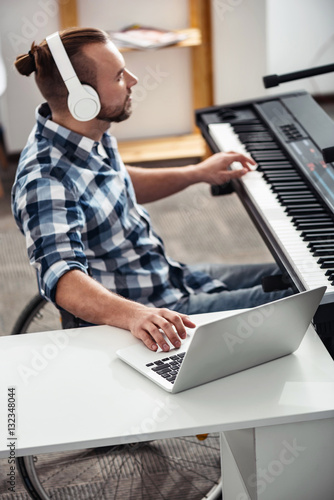 Fotografía Focused disabled composer working on a new tracks