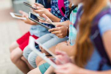 Wall Mural - close up of elementary students with tablet pc