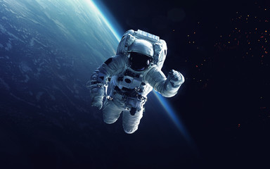 astronaut at spacewalk. cosmic art, science fiction wallpaper. beauty of deep space. billions of gal