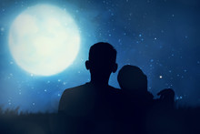 Silhouette Of Asian Couple Looking The Moon