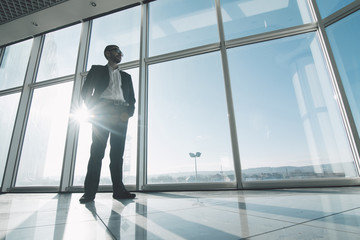 Business man  against panoramic windows