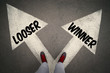 WINNER versus LOOSER written on the white arrows