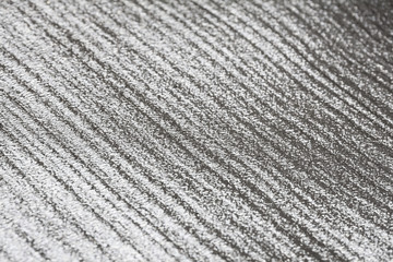 glittery silver uneven surface for texture and background, selective focus