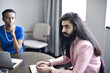 © Andy Paul - Multi ethnic business colleagues in an office meeting