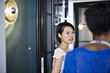 © Andy Paul - Japanese businesswoman talking to colleagues in an office