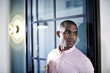 © Andy Paul - Businessman standing in an office doorway