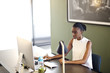 © Andy Paul - Black Businesswoman in an office