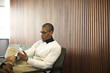 © Andy Paul - Black businessman in an office break out area