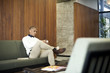© Andy Paul - Black businessman in an office break out area