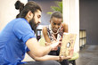 © Andy Paul - Multi ethnic business colleagues in an office break out area