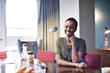 © Andy Paul - Black businesswoman in an office