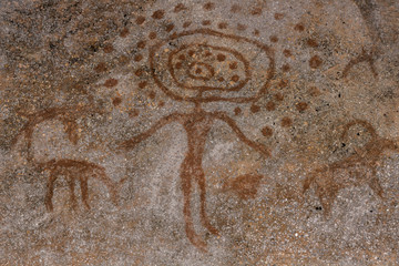 Drawing on a rock cave wall ocher paint, ancient prehistoric Neanderthal man. man surrounded by prehistoric animals, head of intelligence, radiance, lord