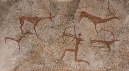 Drawing on a rock cave wall ocher paint, ancient prehistoric Neanderthal man. man surrounded by prehistoric animals, head of intelligence, radiance, lord