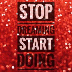 Wall Mural - Stop dreaming start doing words on red shiny glitter background
