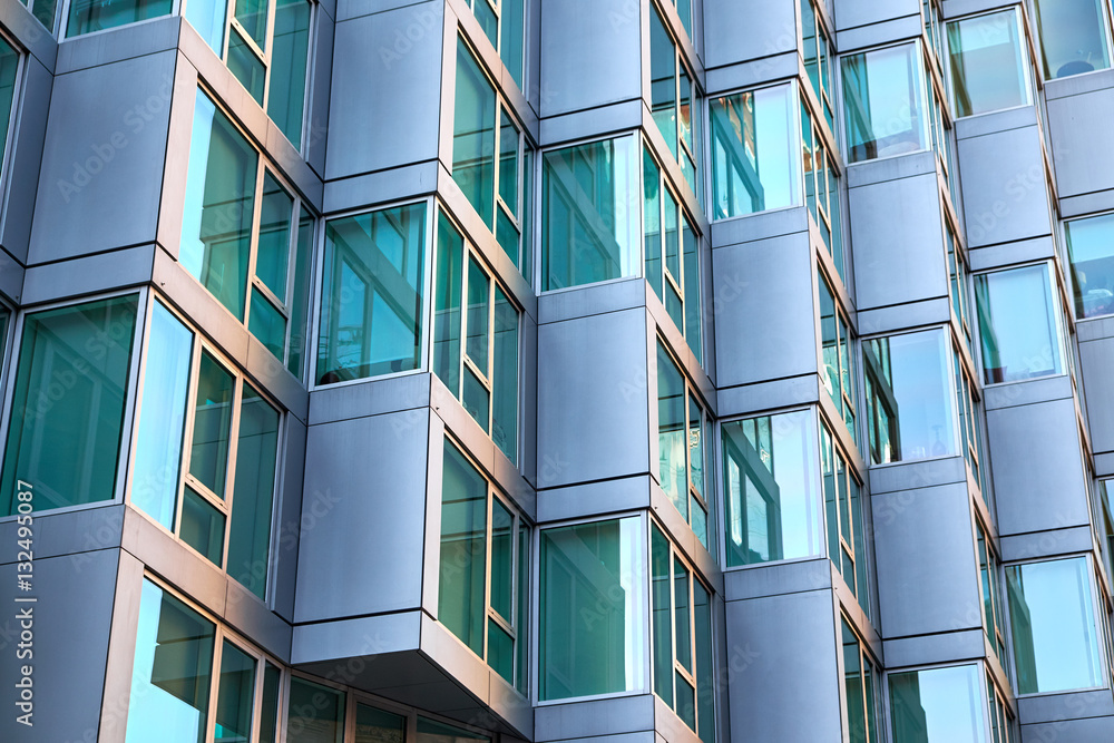 Modern building facade with window sections of aluminum, being tilted ...