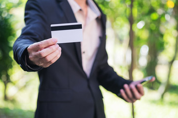 Businessman holding credit card