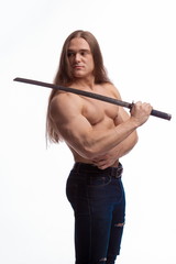 Portrait of a brutal man bodybuilder with bare-chested with long hair with a Japanese sword on a white background