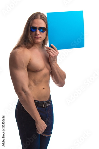 Portrait of a brutal man bodybuilder athlete with long hair with a sheet of pape Poster