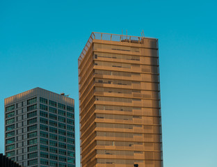 Two modern high rises stand side by side