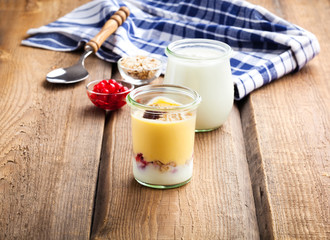 Wall Mural - natural yoghurt on a wooden background