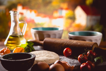 Fresh and tasty homemade pizza on wooden table with ingredients