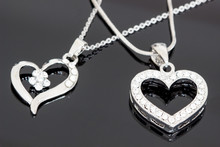 Silver Jewelry / Necklaces With Heart Pendants On Black Background / Necklaces With Heart Pendants For Woman