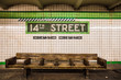 Bench at New York City subway station with vintage tile wall