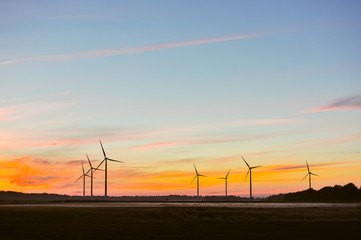 Wall Mural - Silhouette of wind turbine on sunset