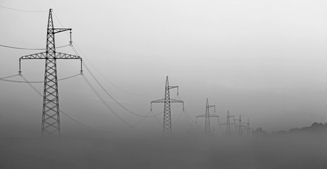 High-voltage tower in the fog