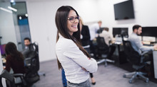 Businesswoman Walking In Office And Smiling