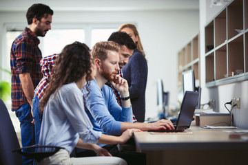 Colleagues working together in company office