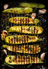 Grilled zucchini with addition of thyme, lemon zest and garlic, top view