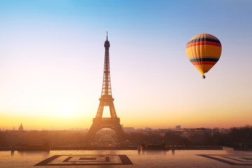 Wall Mural - travel concept, beautiful view of hot air balloon flying near eiffel tower in paris, france, tourism