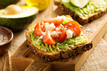 Wall Mural - Avocado toast with tomatoes and feta