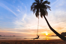 Summer Holidays, Happy Woman On The Swing On Tropical Beach At Sunset