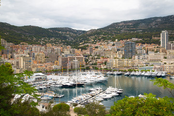 Wall Mural - Principality of Monaco. View of the seaport and the city of Monte Carlo with luxury yachts and sail boats 
