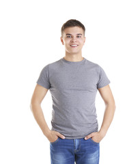 Wall Mural - Handsome young man in blank grey t-shirt on white background