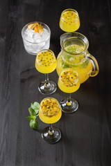 Wall Mural - Alcoholic cocktail with fresh passion fruit with mint and ice. D