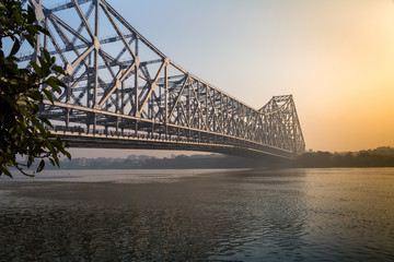 Howrah bridge on river Ganges on a foggy winter morning. Kolkata, India.