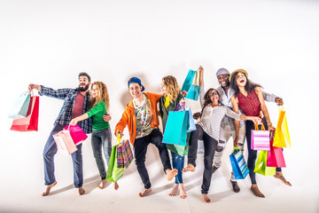 Several people holding shopping bags