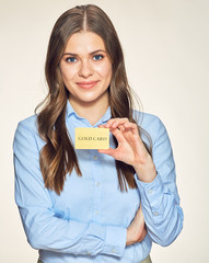 smiling business woman presenting gold credit card.