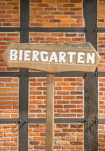 Beer Garden Sign In Front Of A Half-timbered Wall