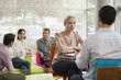 © PhotoAlto - Woman having casual meeting with colleague