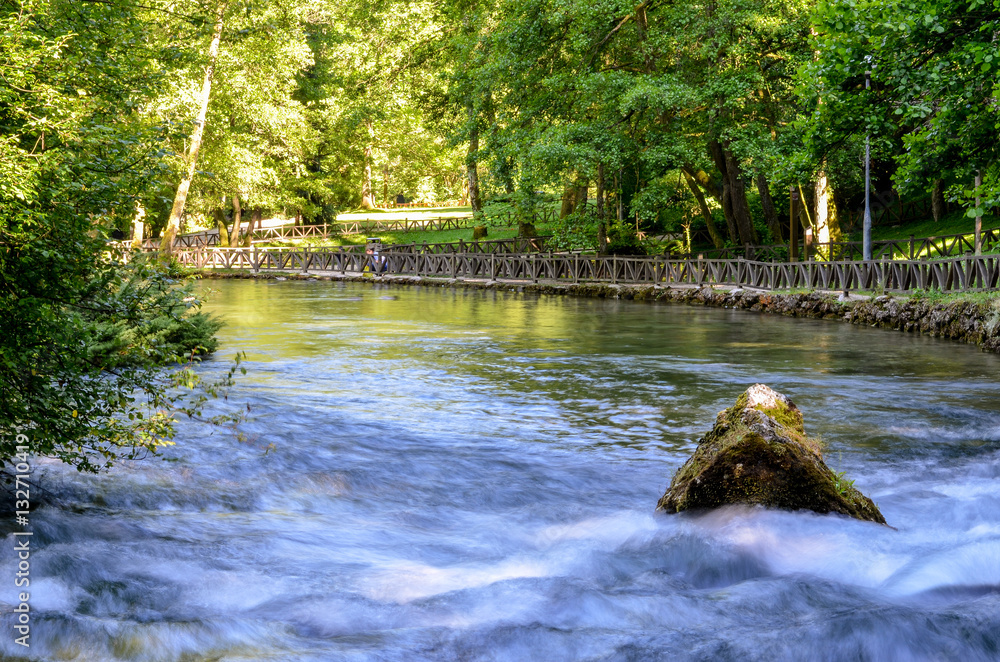 Spring of the Bosna river, small waterfall and park Vrelo Bosne near ...